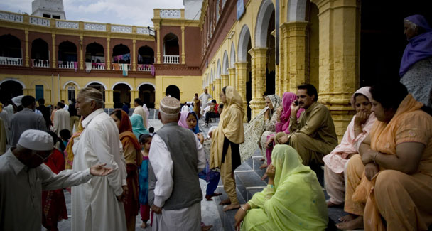 Pakistani people from Sikh community who fled Mingora and Buner in the troubled valley of Swat, take refuge in their temple in Hasanabdal, 45 kilometers from Islamabad, Pakistan, on Friday, May 8, 2009.  AP